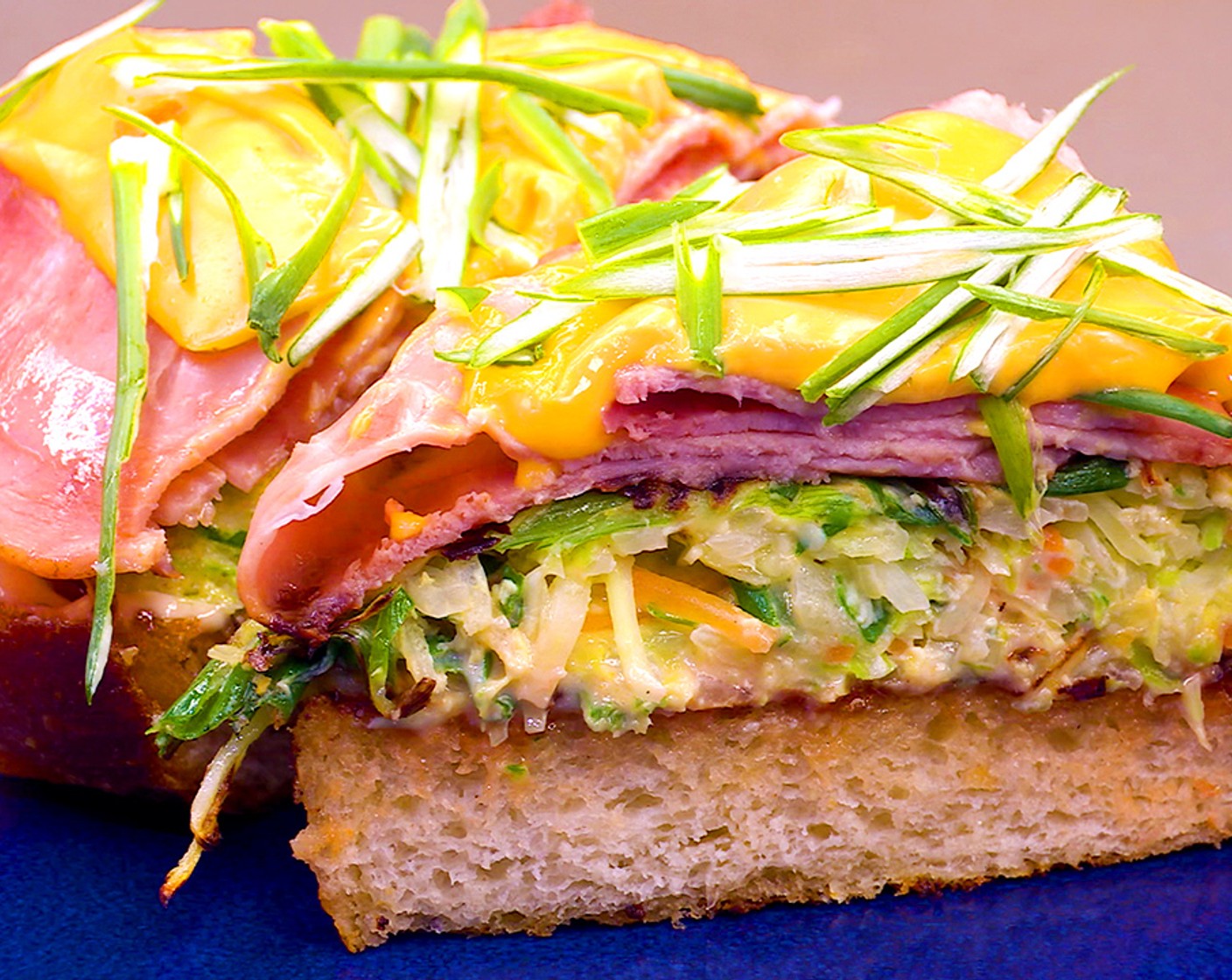 step 8 Drizzle the bread with Ketchup (to taste) and Mayonnaise (to taste), if desired. Place the cabbage on top of the bread and top with the ham and cheese. Sprinkle more scallions to finish.