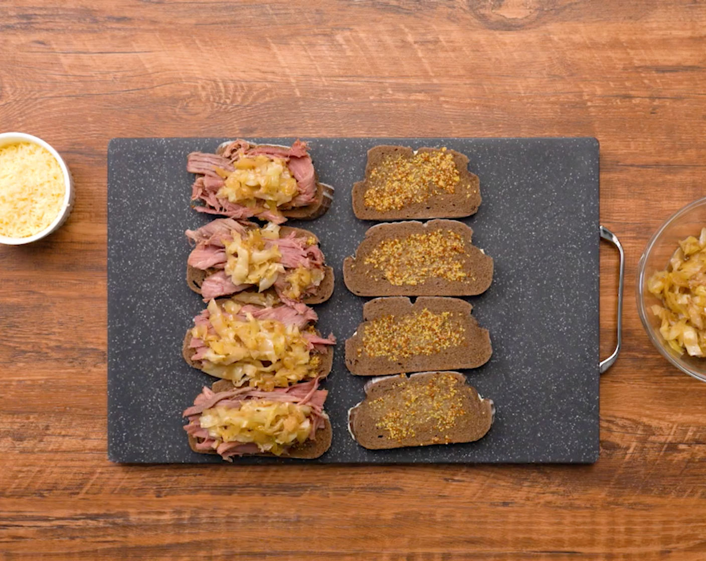 step 5 On the other side of the bread, spread Whole Grain Mustard (1 Tbsp). Layer the sandwiches with Corned Beef Brisket (4 oz), cabbage mixture, and American Cheese Slices (4). Stack the other slice of bread on top mayonnaise side out.