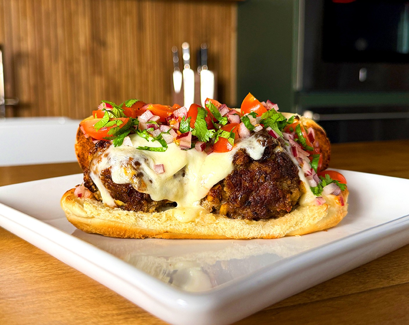 step 4 Place the meatballs on the toasted Hoagie Rolls (2) and top with Fresh Mozzarella Cheese Ball (2). Place under the broiler to melt the cheese and finish by spooning the salsa over the top.