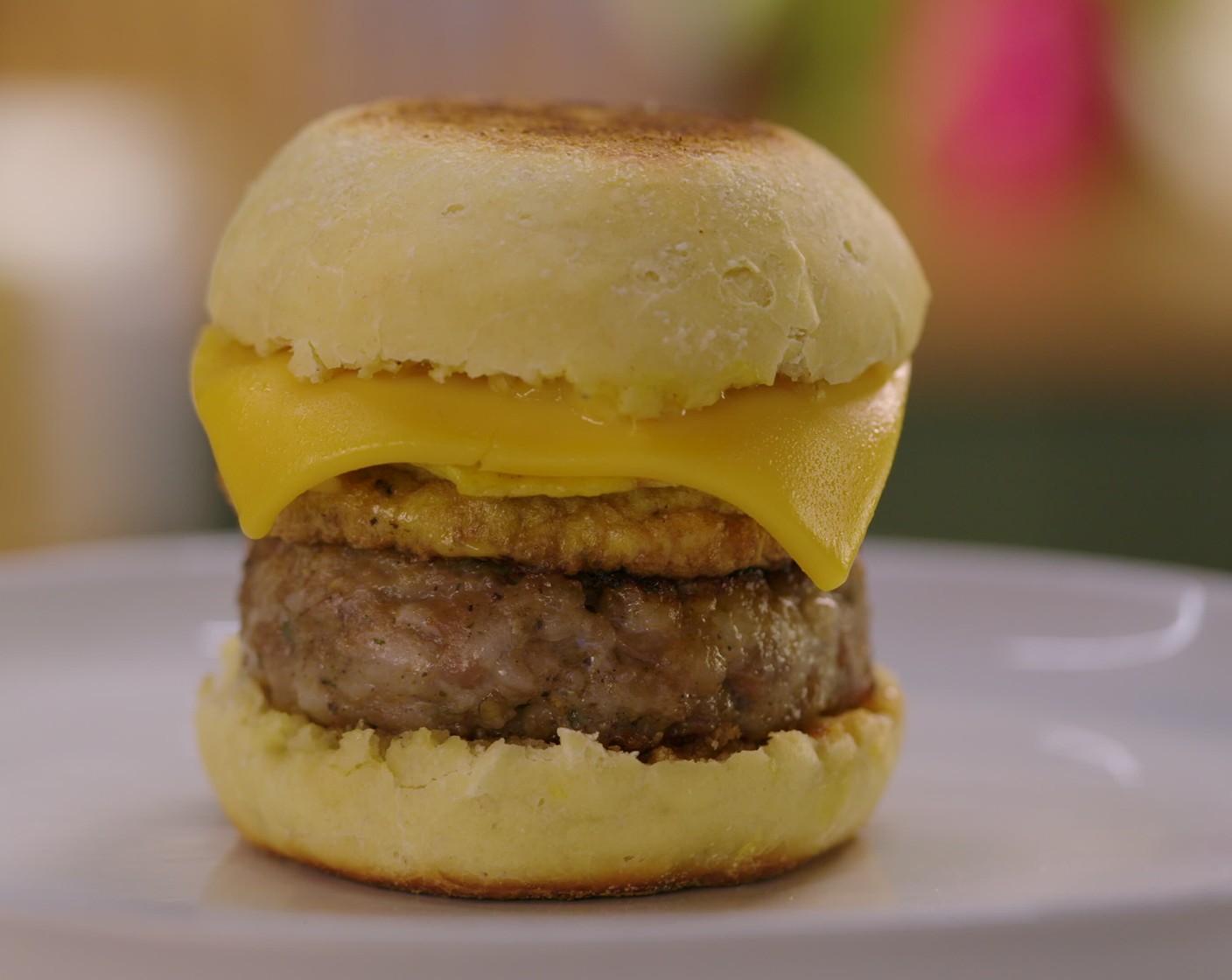 step 16 To assemble: Use a fork to pierce the muffin open by inserting it deep around the edges, going all the way around the muffin. Place a sausage patty on the bottom side of the English muffin. Top with a cooked egg and cheese and then the top of the English muffin. Enjoy!