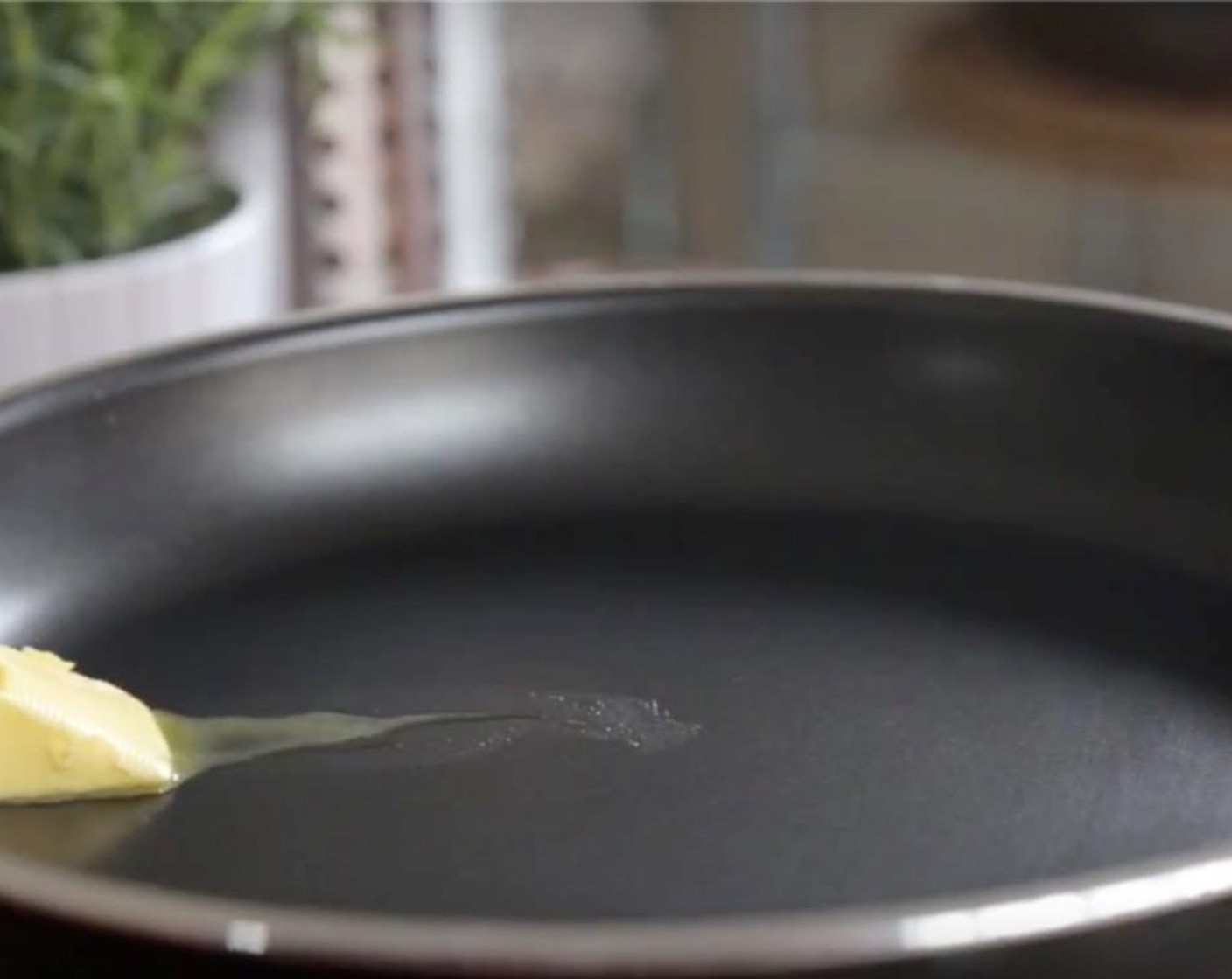 step 2 Heat a small non-stick skillet  over medium. Slide in half of Unsalted Butter (1 tsp)