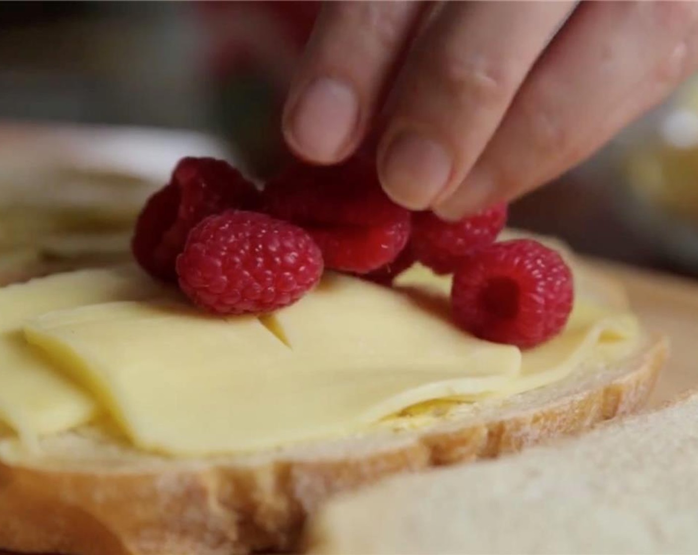 step 4 Layer Fresh Raspberries (4 Tbsp) over the cheese.