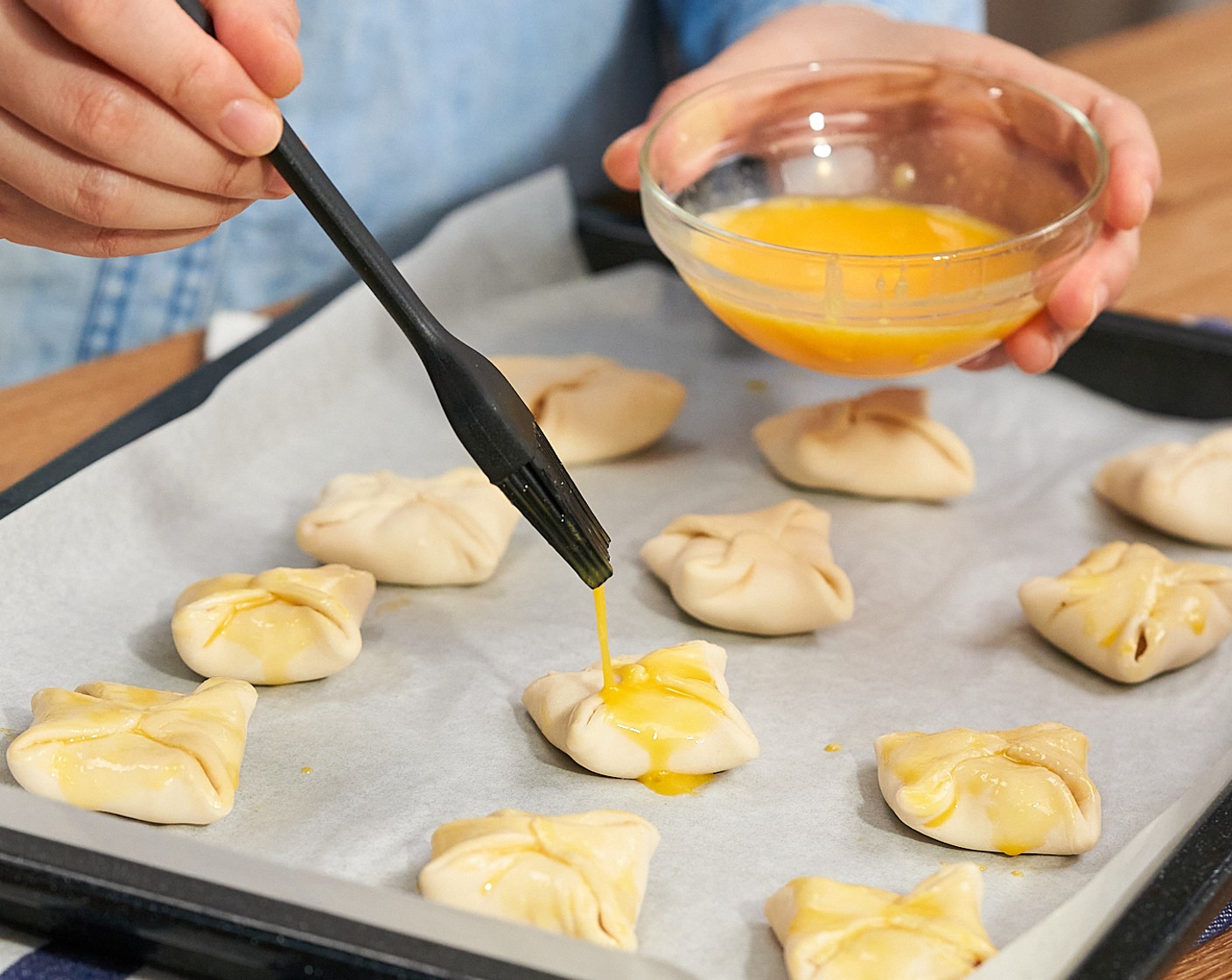 step 7 Brush all sides of the pastry with Egg Wash (1). Bake for 10-15 minutes or until puffed and golden.