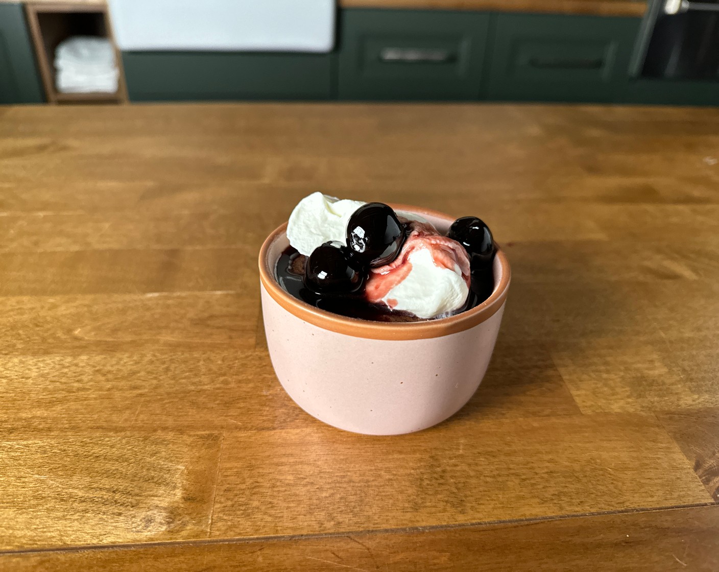 step 9 Top each lava cake with a generous spoonful of the marinated cherries and a dollop of whipped cream. Serve immediately.