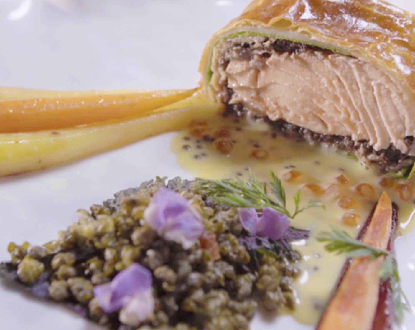 Salmon Wellington Spinach Crepes, Smoked Salmon with Chestnut Crimini Mushroom Duxelles Filling Caper and Double Caviar Beurre Blanc, Rainbow Carrots
