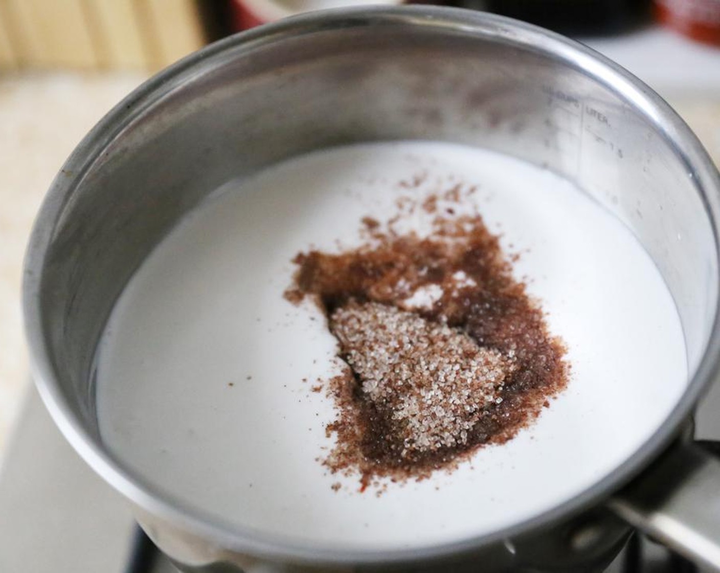 step 1 Place the Unsweetened Coconut Milk (3 cups), Cinnamon Sugar (4 Tbsp) and Chung Jung One® Gochujang Korean Chili Sauce (3 Tbsp) in a saucepan.