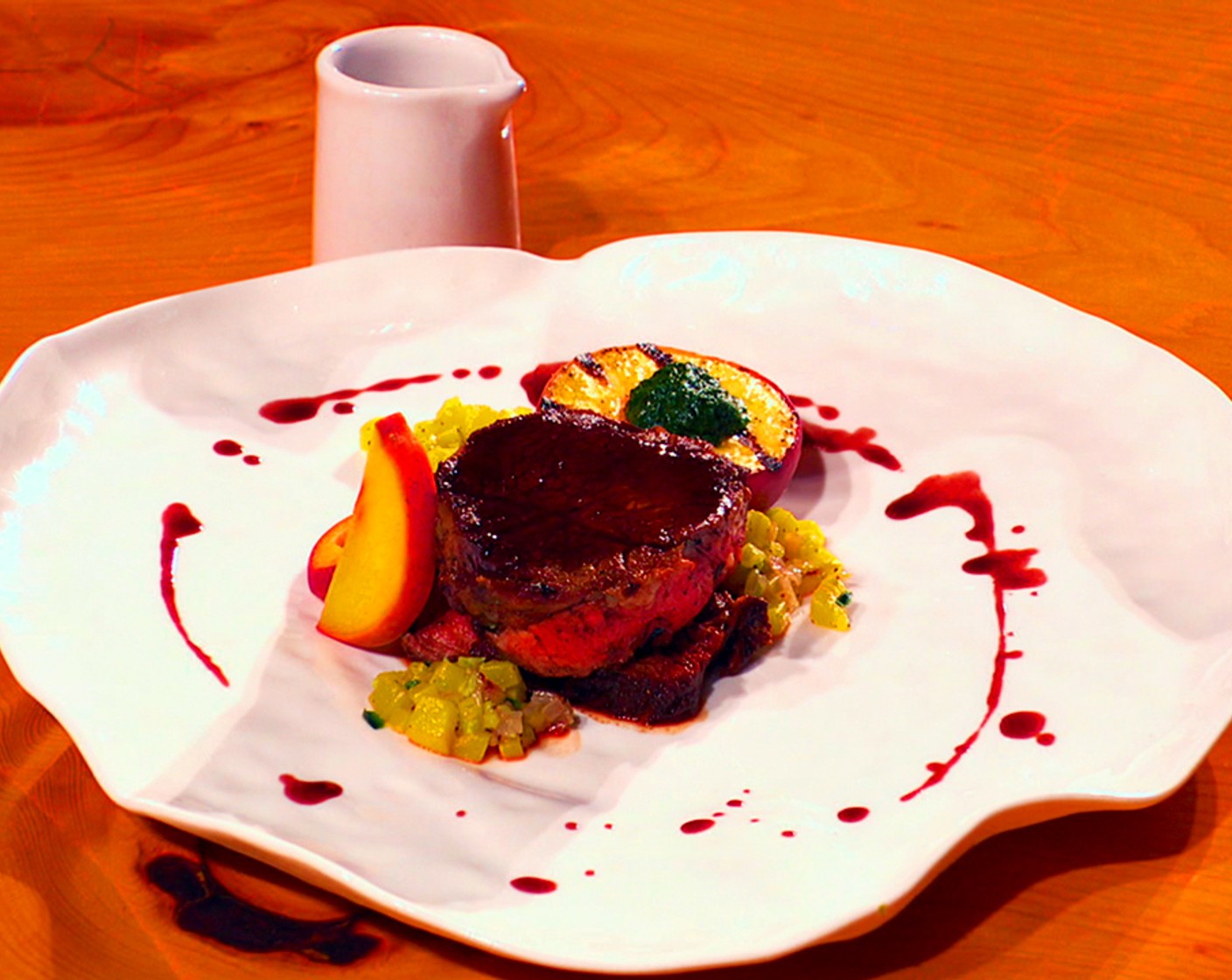 Ribeye Steak, Spicy Grilled Pickled Peach, Sauteed Summer Squash, Herb Puree, Red Wine Reduction