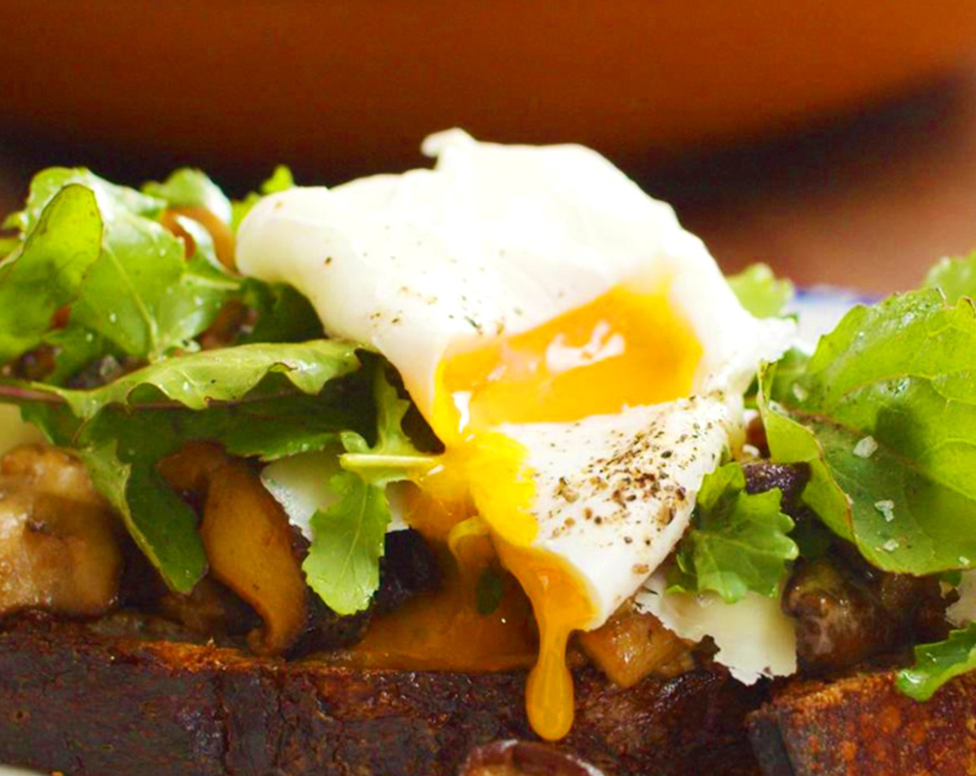 step 9 Place a few generous spoonfuls of mushrooms and sauce on top of toasted bread, then top with Arugula (1 cup) leaves. Nestle the eggs atop the greens and top with shaves of Gruyère Cheese (2 Tbsp) Add Lemon Juice (1 tsp). Olive Oil (1 tsp) Salt (to taste) and Freshly Ground Black Pepper (to taste) to taste.