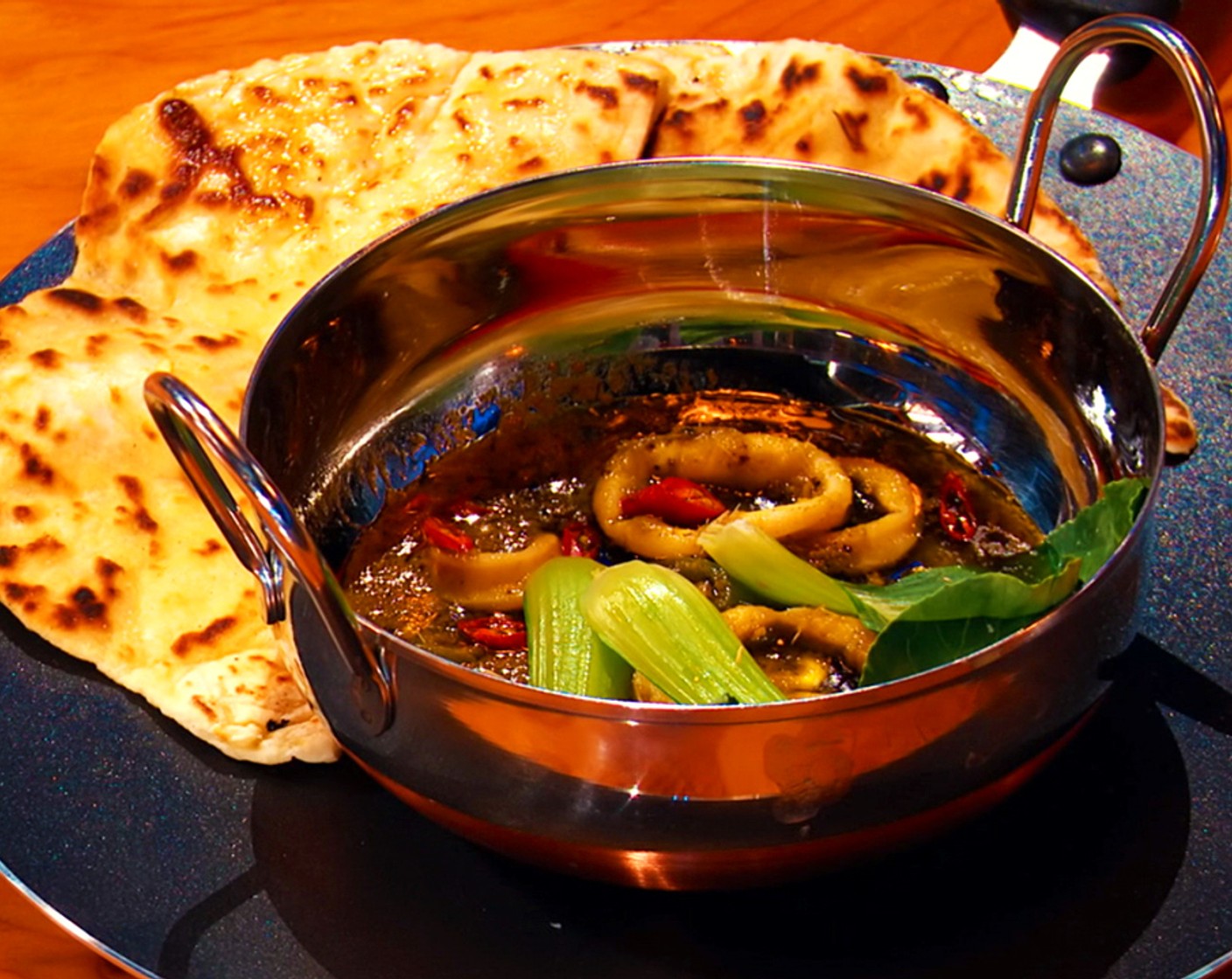 step 14 Top with bok choy and serve with naan.