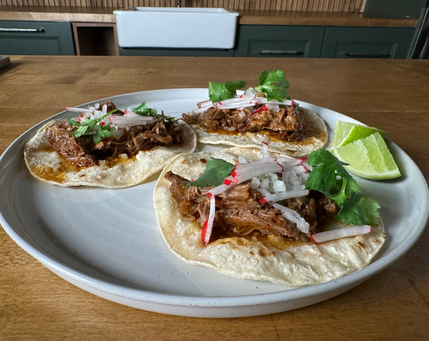 step 10 Top with Radish (1/2 cup), White Onion (1/2 cup), and Fresh Cilantro Leaf (1/2 cup). Drizzle with reserved sauce and Limes (2), if desired.