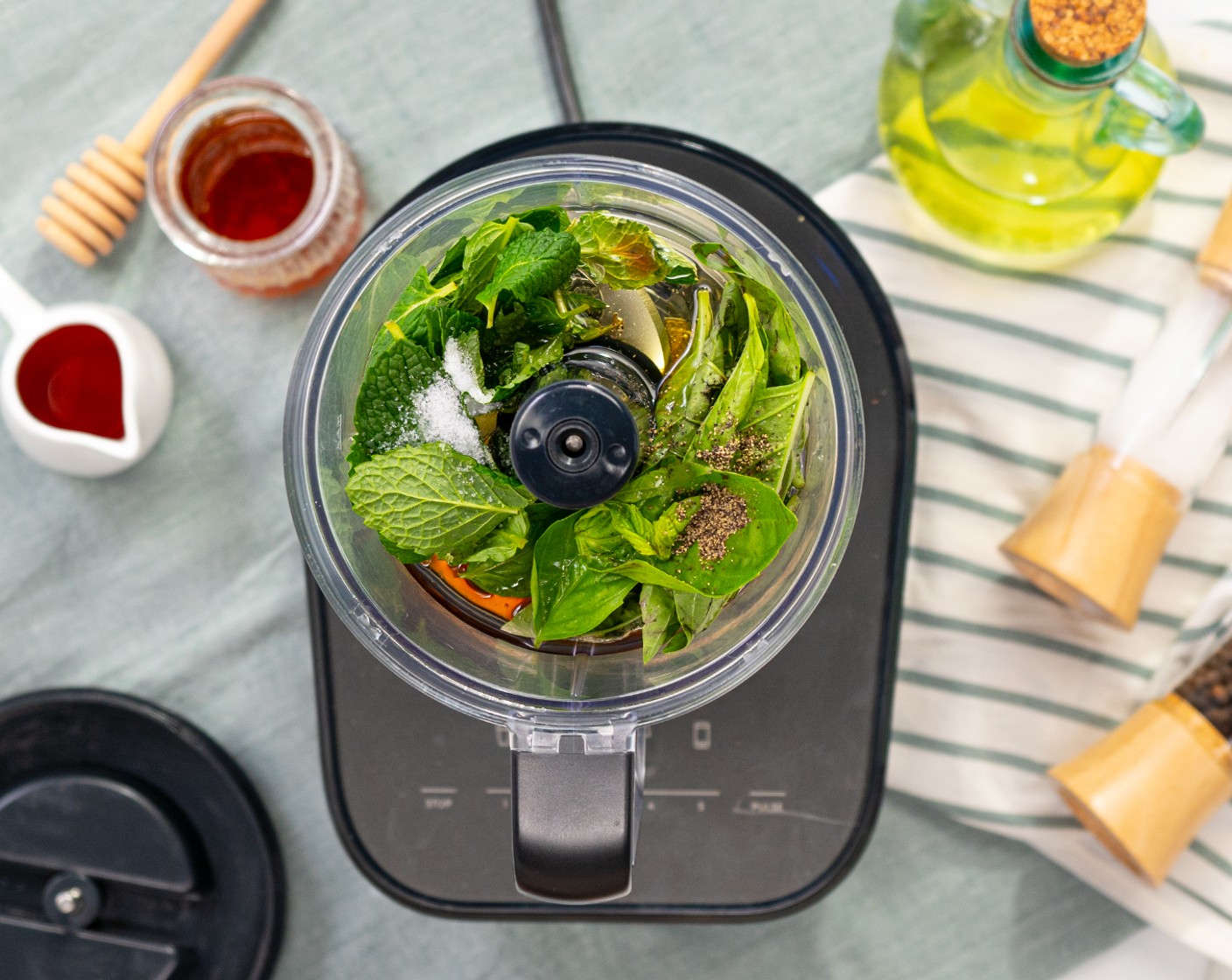 step 2 In a food processor, add Fresh Mint Leaves (4 Tbsp), Fresh Basil Leaves (4 Tbsp), Extra-Virgin Olive Oil (1/2 cup), Red Wine Vinegar (3 Tbsp), Honey (1 tsp), Salt (1/4 tsp), and Ground Black Pepper (1/8 tsp). Pulse until everything combines.