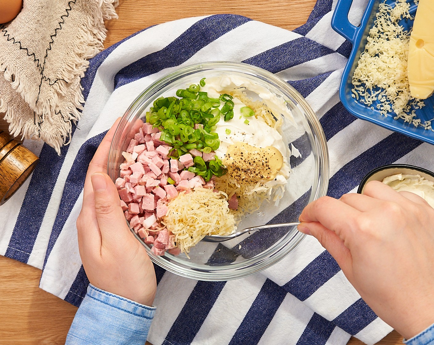 step 3 In a medium mixing bowl, combine the Cooked Ham (3 oz), Swiss Cheese (3/4 cup), Cream Cheese (1/2 cup), Scallion (1 stalk), Dijon Mustard (1 tsp), and Pepper (to taste) together. Set aside.