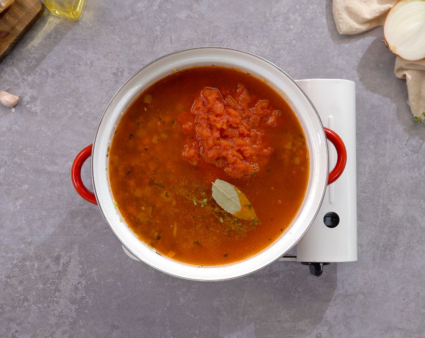 step 5 Add Diced Tomatoes (1 can), Vegetable Broth (4 cups), Fresh Thyme (1 sprig), Bay Leaf (1), and Tabasco® Original Red Pepper Sauce (1 tsp). Bring to a simmer and cook for about 10 minutes. Season with Salt (1/2 tsp) and Ground Black Pepper (1/2 tsp).