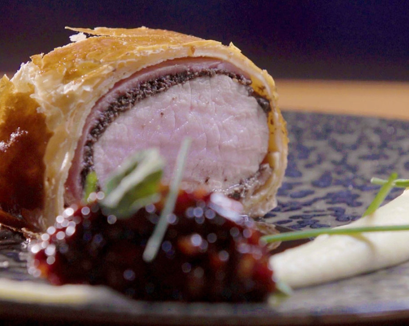 Veal Wellington with Pancetta, Crepes and Parsnip Puree Balsamic Caramelized Pancetta Onion Jam and Herb Oil