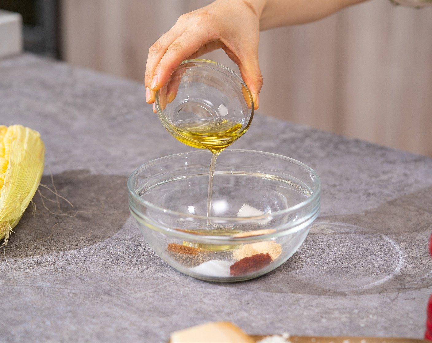 step 2 In a small bowl, combine Garlic Powder (2 tsp), Paprika (1 tsp), Salt (1 tsp), Ground Black Pepper (1/2 tsp), Cayenne Pepper (1/4 tsp), and Olive Oil (4 Tbsp).