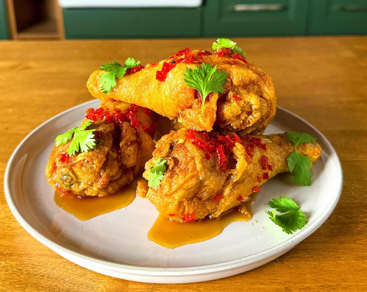 step 6 Just before serving, toss the fried chicken in the prepared dipping sauce, garnish with Fresh Cilantro (to taste), and serve immediately.
