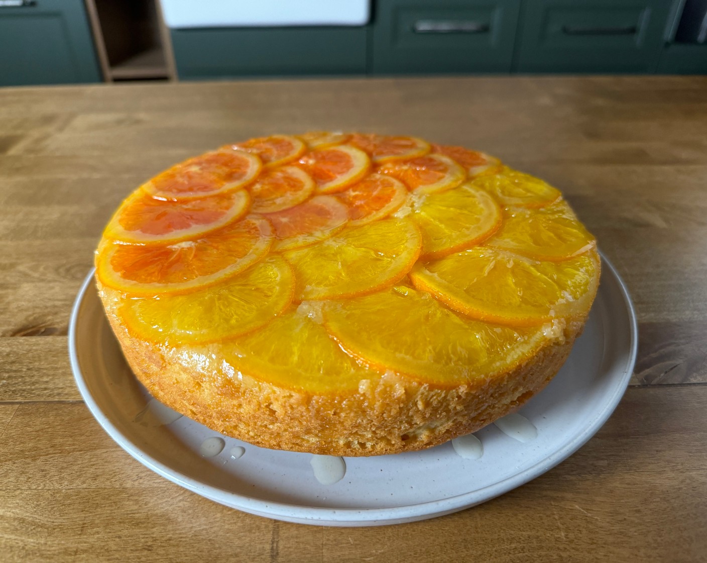 step 12 Brush some of the remaining orange syrup over the top of the cake for added shine and flavor.